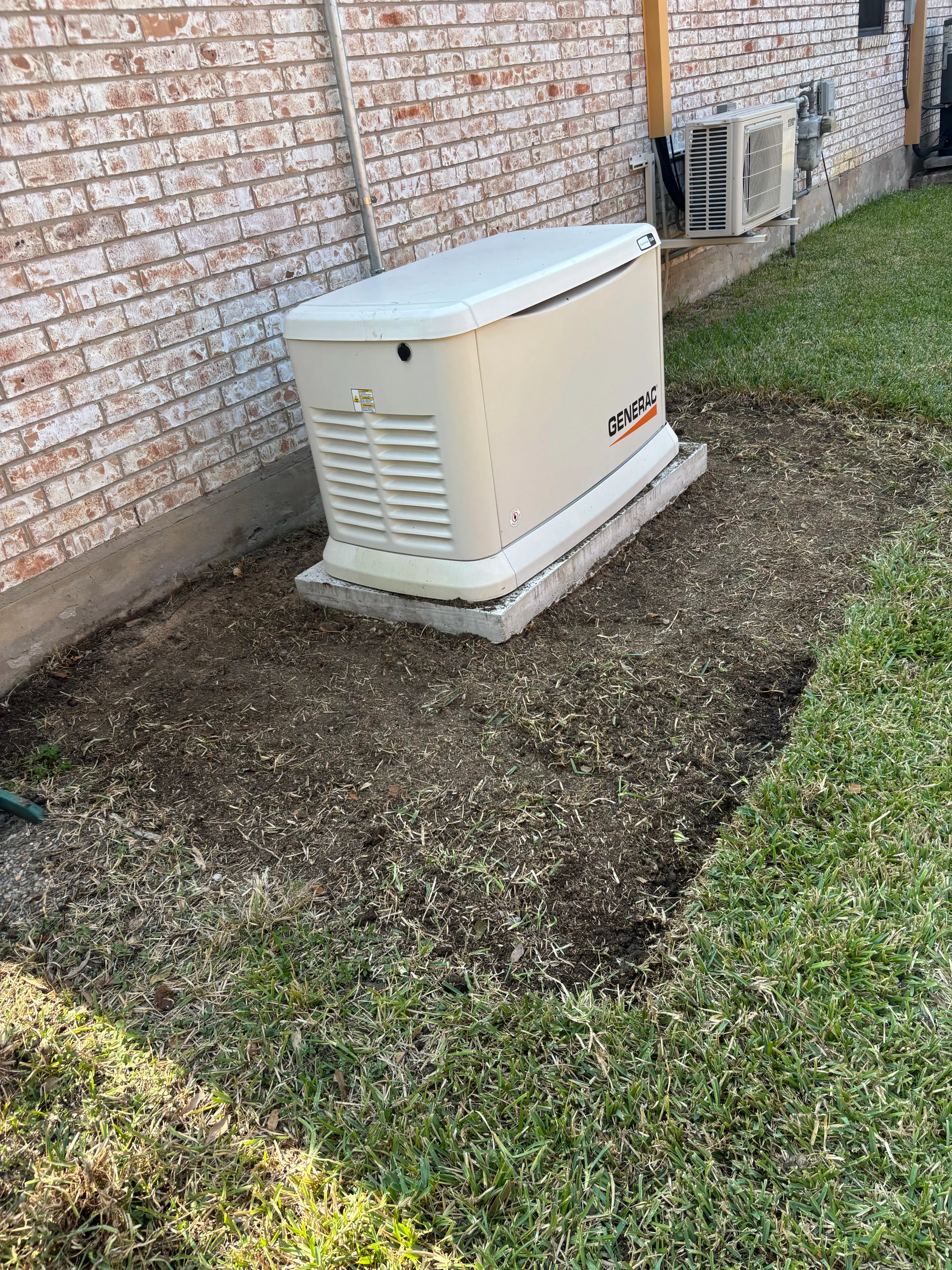 Generator bed patch with just dirt, before a project.