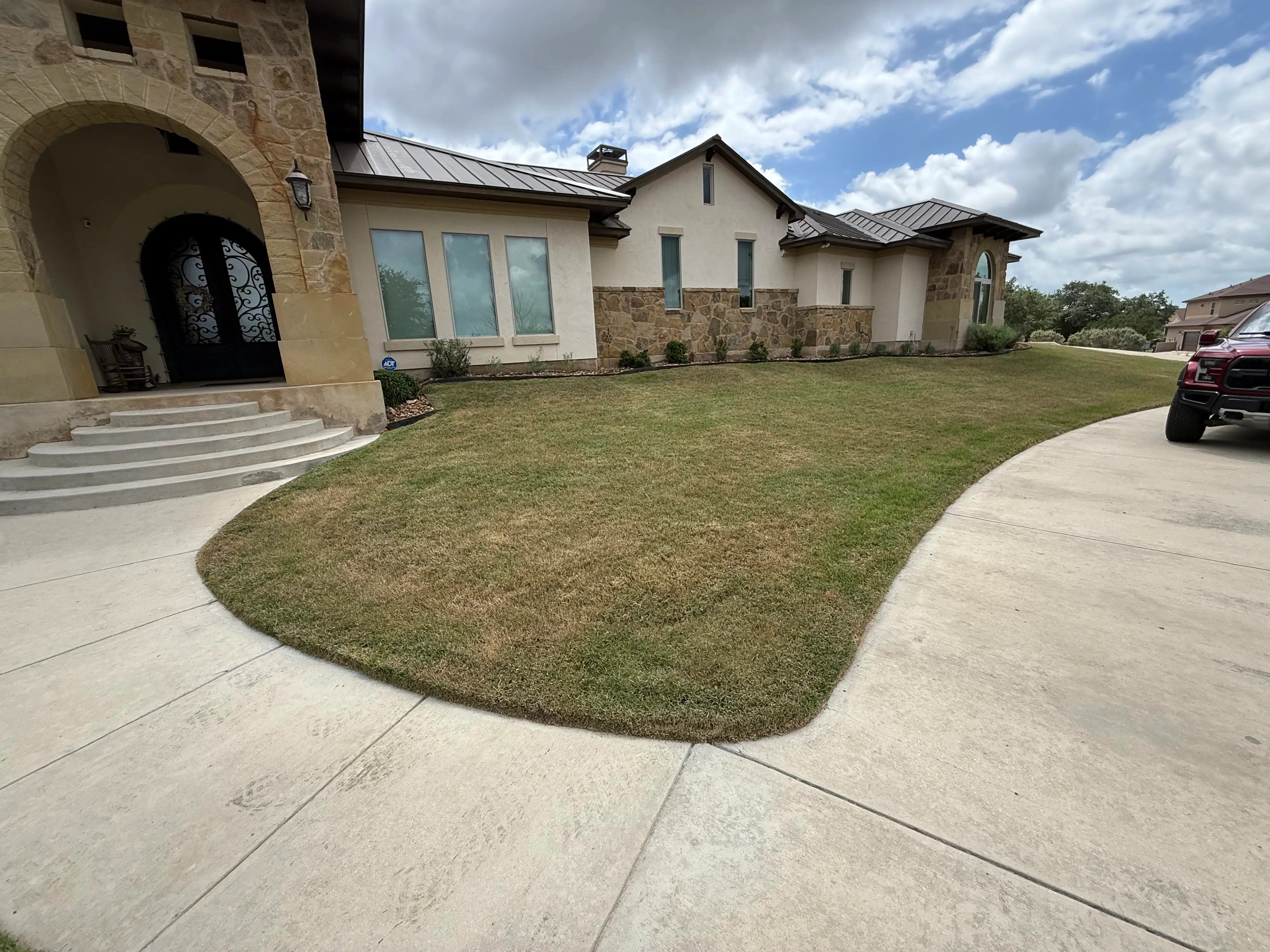 Front of house showing well mowed lawn